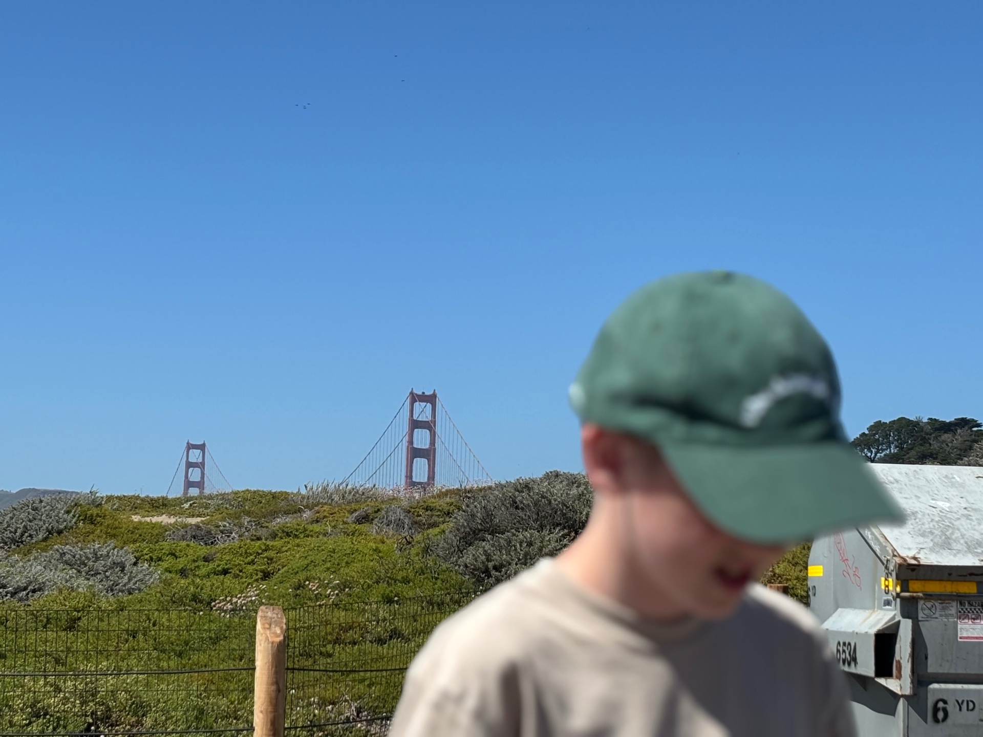 Alfred Murray outdoors, with the Golden Gate Bridge behind him